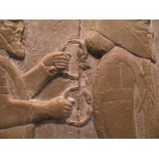 Traveling people, holding a double headed animal bracelet